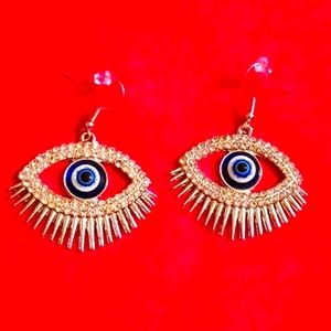 Beautifully detailed evil eye earrings that stand out make a witchy statement